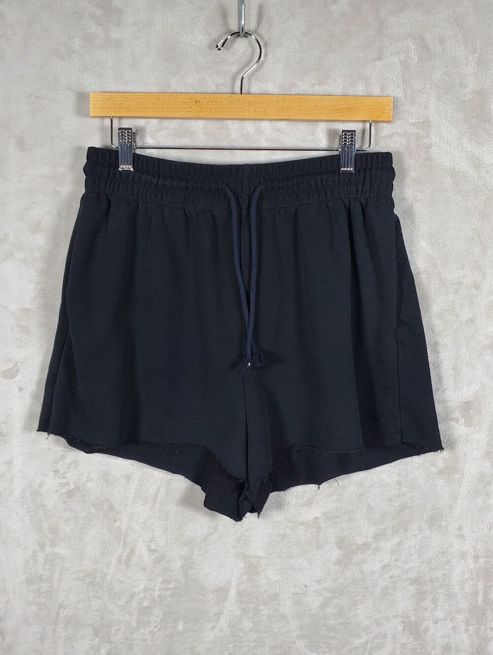 Versatile H&M black sweat shorts with a relaxed casual look, perfect for loungin